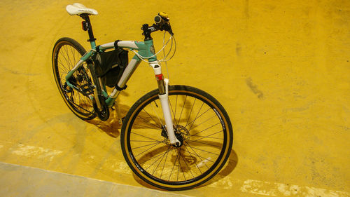 Bicycle parked against wall