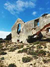 Low angle view of old building against sky