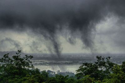 Scenic view of sea against cloudy sky