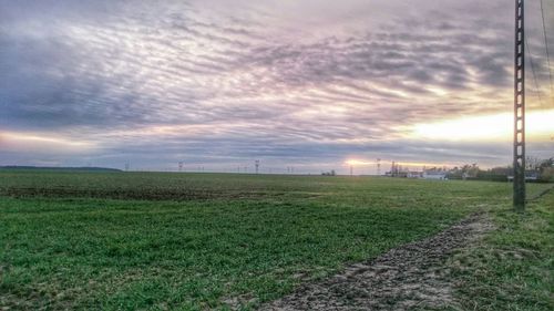 Scenic view of landscape against cloudy sky