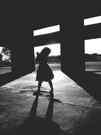 Shadow of woman on wall