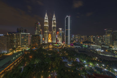 Illuminated buildings in city at night