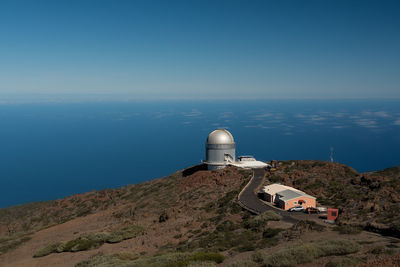 Roque de los muchachos observatory on mountain against sky