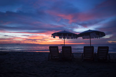 Scenic view of beach against sky during sunset