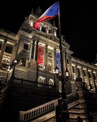 Low angle view of illuminated building at night