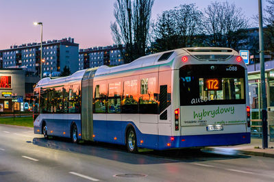 Traffic on road in city against sky