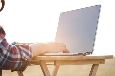 Low angle view of man working on table