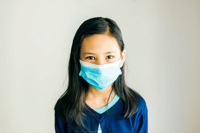 Portrait of a teenage girl wear a facemask 