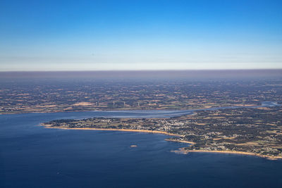 Scenic view of sea against blue sky