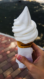 Midsection of person holding ice cream cone