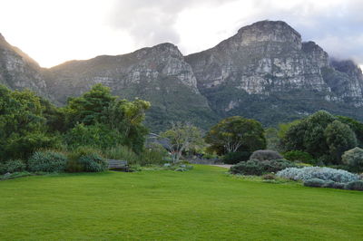 Scenic view of mountains against cloudy sky