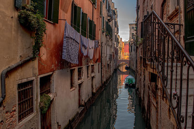 Canal amidst buildings in city