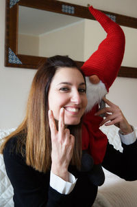 Portrait of smiling young woman using mobile phone