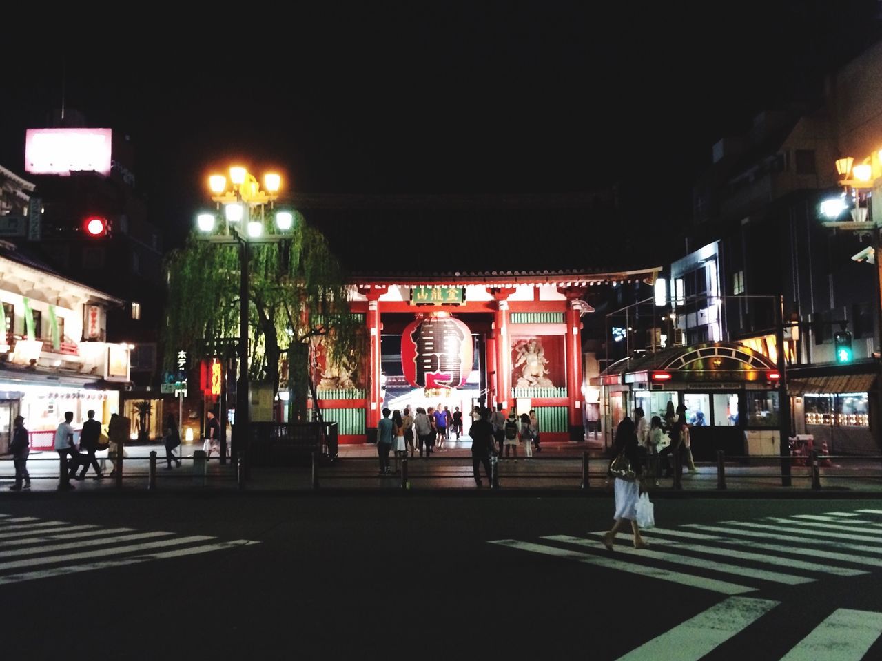 night, illuminated, building exterior, architecture, built structure, lighting equipment, city, street, street light, incidental people, outdoors, decoration, city life, tradition, store, lantern, celebration, religion, text