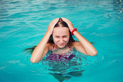 Portrait of woman in swimming pool