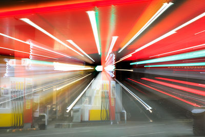 Blurred motion of illuminated subway station