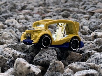 Close-up of toy car on rock