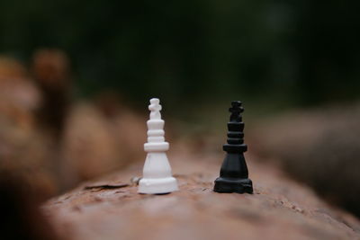 Close-up of chess pieces on wall outdoors