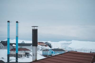 Buildings in city against sky