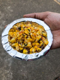 High angle view of person holding food