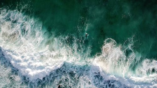 High angle view of water splashing in sea