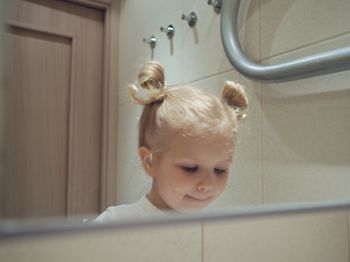 Portrait of cute boy in bathroom