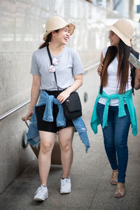 Tourists on footpath in city