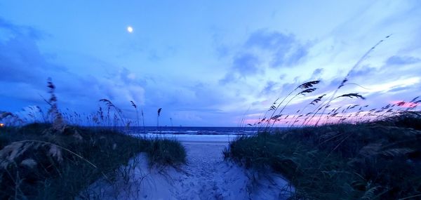 Scenic view of sea against sky at sunset