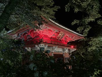 Low angle view of illuminated building at night