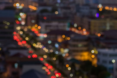 Defocused image of illuminated city at night