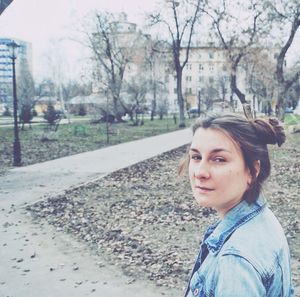 Portrait of young woman in park