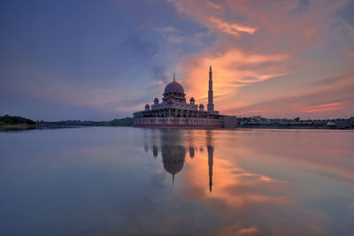 Reflection of mosque in water at sunrise in putrajaya, malaysia