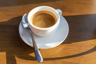 High angle view of coffee cup on table