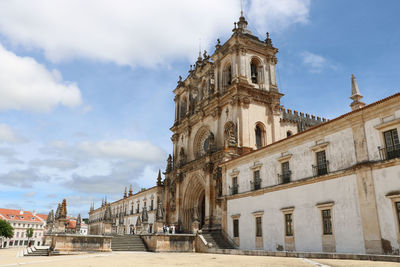 Low angle view of the monumental saint mary monastery in alcobaça, portugal.