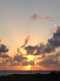 Scenic view of beach against sky during sunset