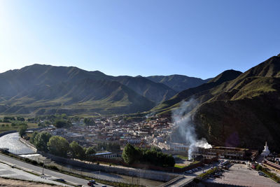 Scenic view of mountains against clear blue sky