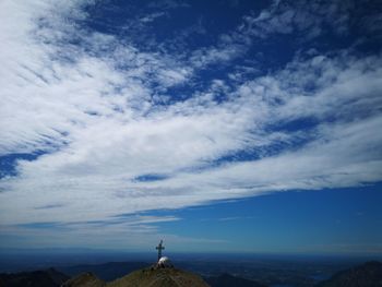 Scenic view of mountain against blue sky