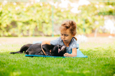 Woman with dog on field