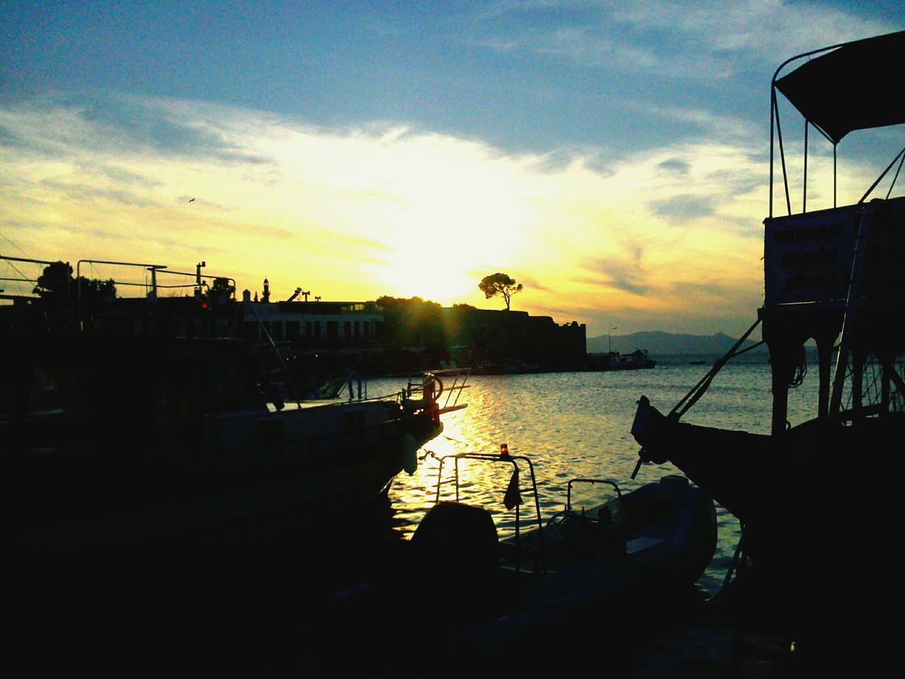 sunset, sky, nautical vessel, water, cloud - sky, transportation, mode of transport, silhouette, sea, boat, moored, cloud, sun, sunlight, nature, orange color, harbor, built structure, scenics, beauty in nature