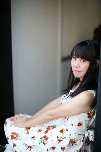 Portrait of smiling woman sitting at cafe