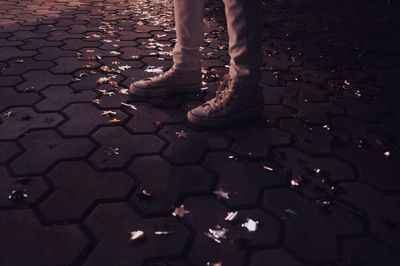 Low section of woman walking on floor