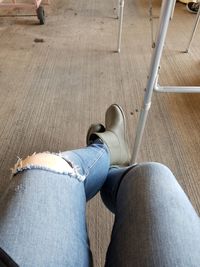 Low section of man sitting on floor