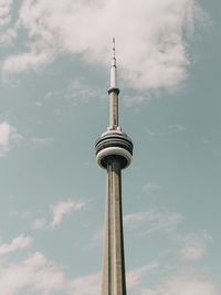 Low angle view of communications tower against sky