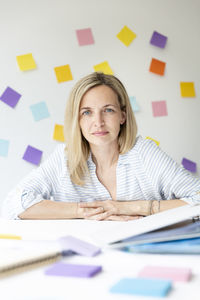 Portrait of businesswoman sitting at office