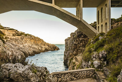 Bridge over sea against sky