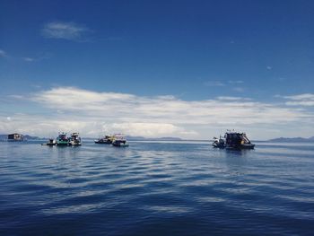 Scenic view of sea against blue sky