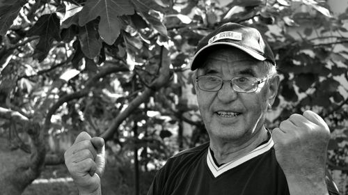 Portrait of man against plants