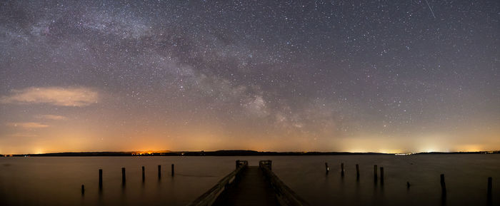 Scenic view of lake against star field at night