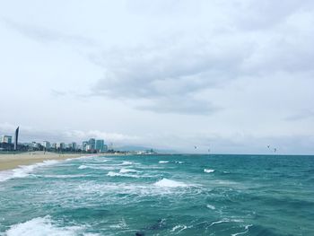 Scenic view of sea against cloudy sky