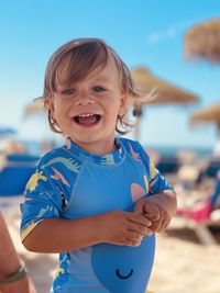 Portrait of cute smiling girl on beach
